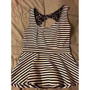 White with black striped flare-out blouse.